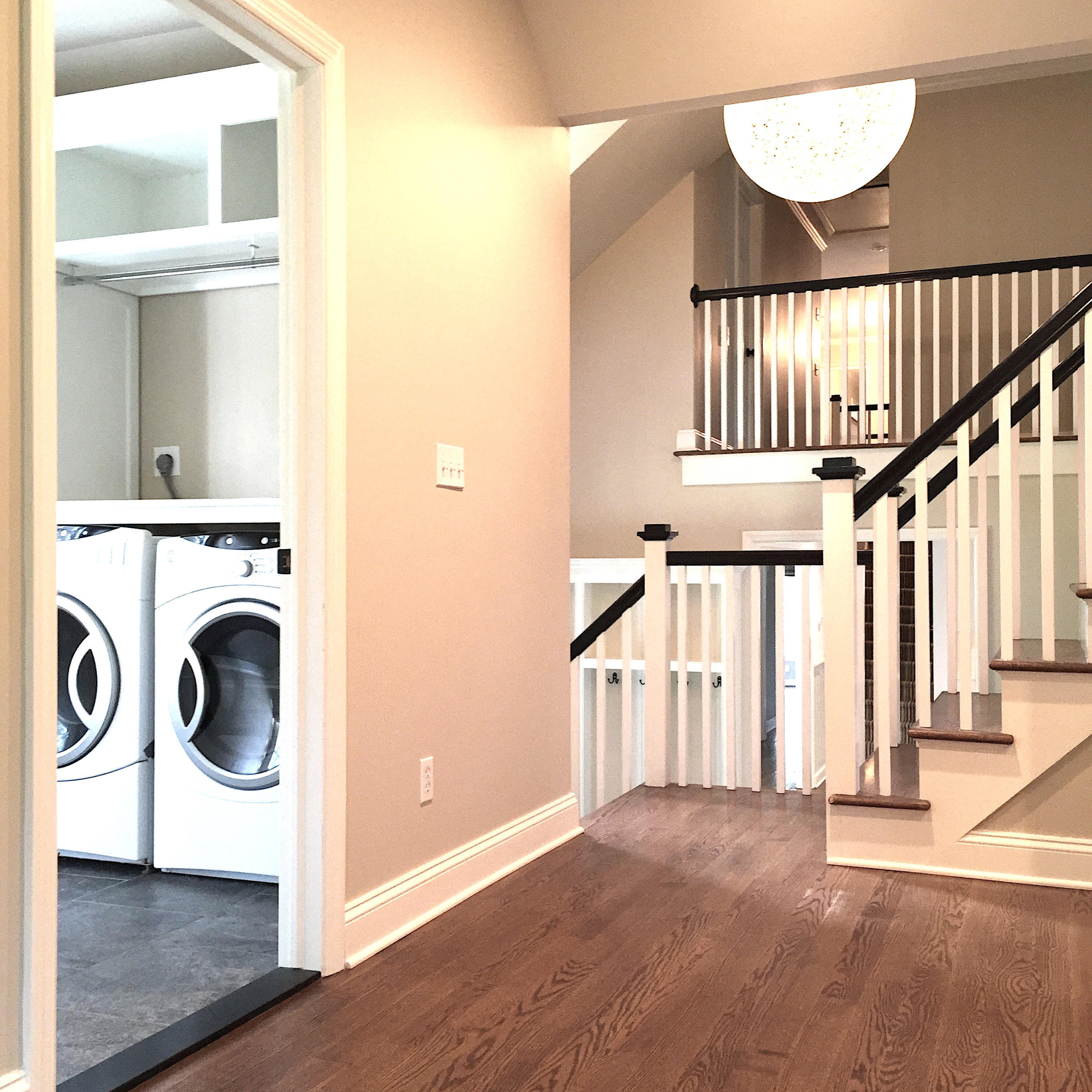 181 Middlesex Road Darien, CT 06820 - Photo 31 of 38 a view of a hallway with entryway wooden floor and front door