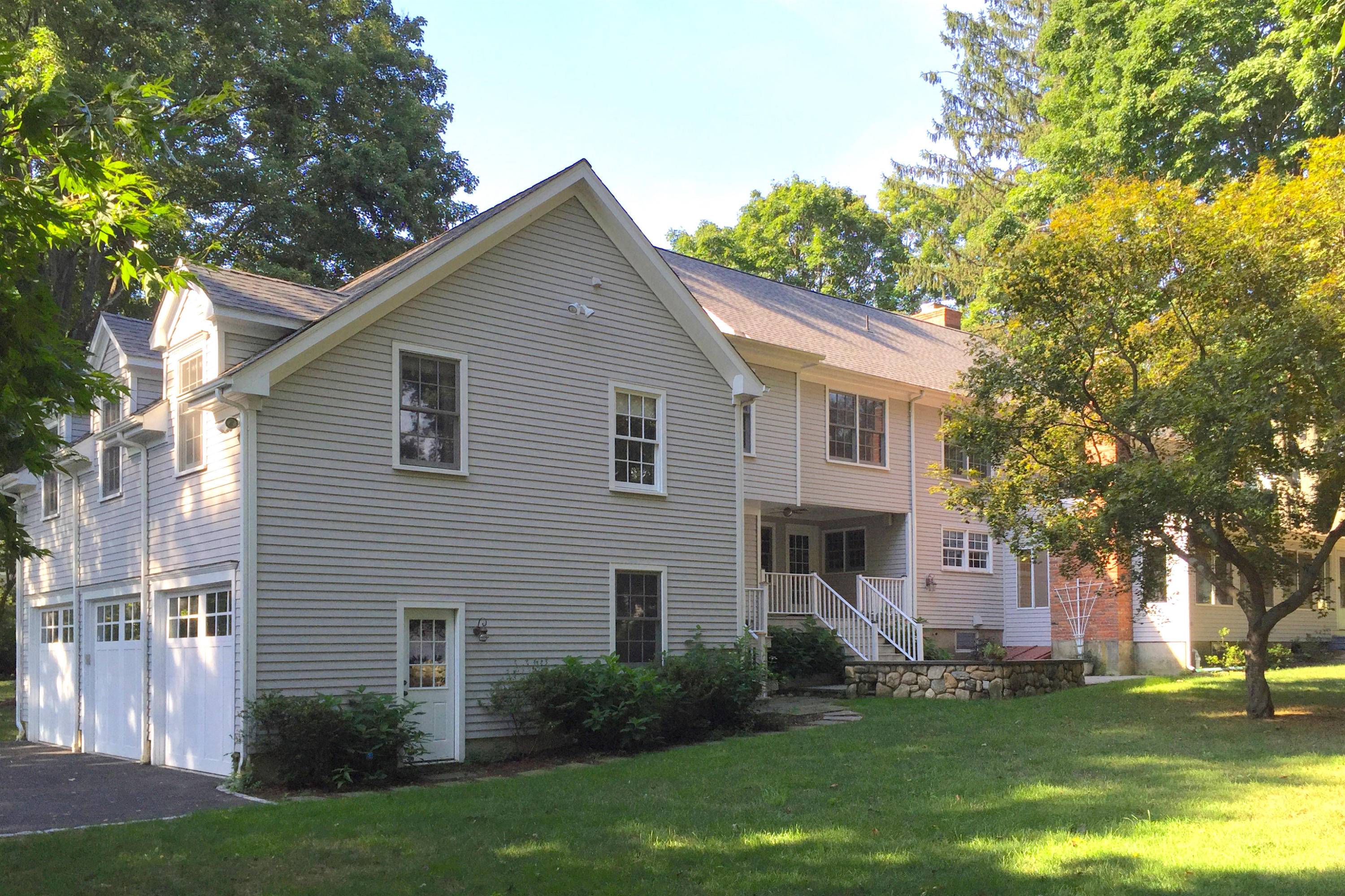 181 Middlesex Road Darien, CT 06820 - Photo 34 of 38 a view of a yard in front of a house with plants and large tree