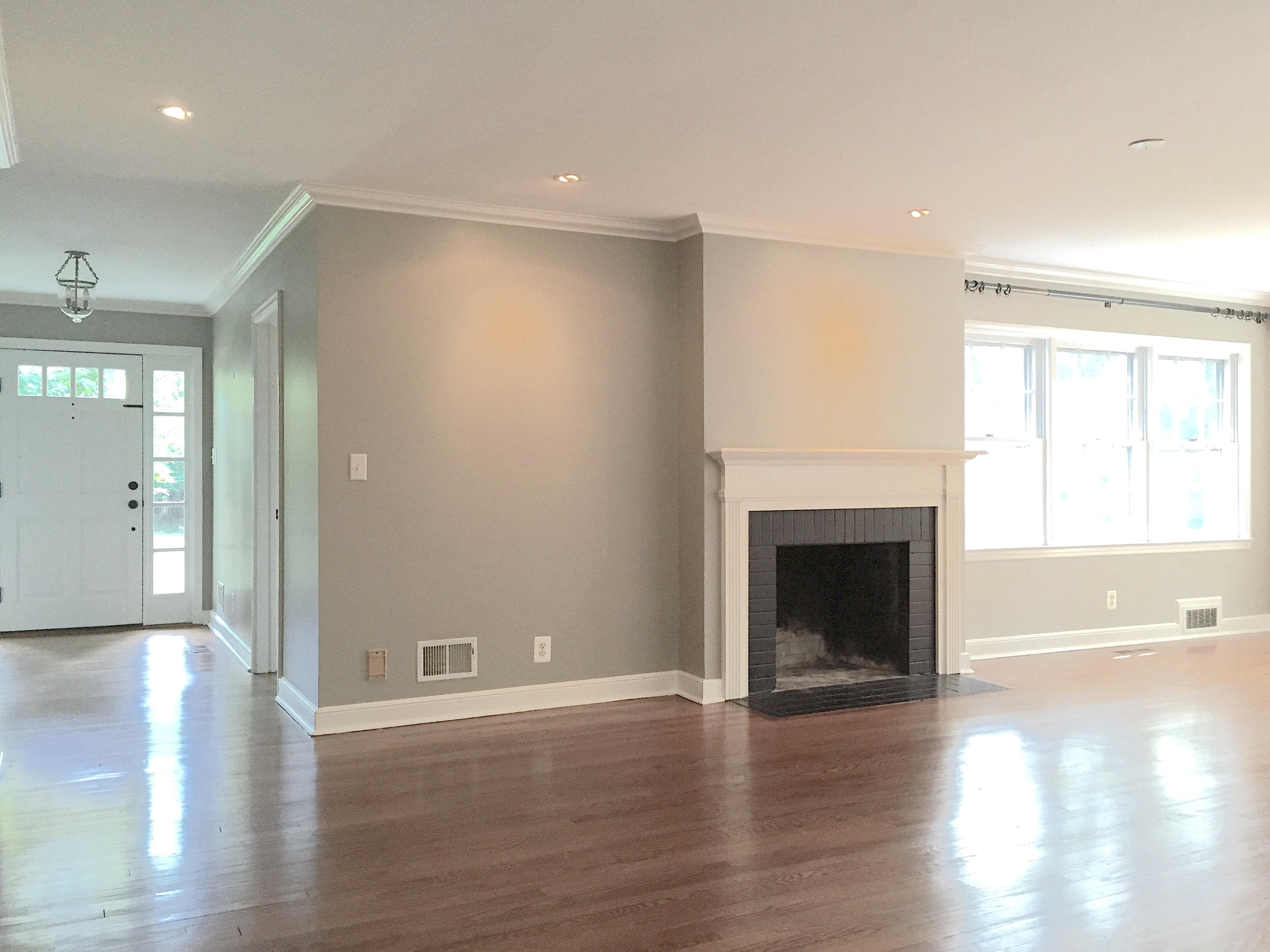 181 Middlesex Road Darien, CT 06820 - Photo 7 of 38 a view of a livingroom with wooden floor and a fireplace