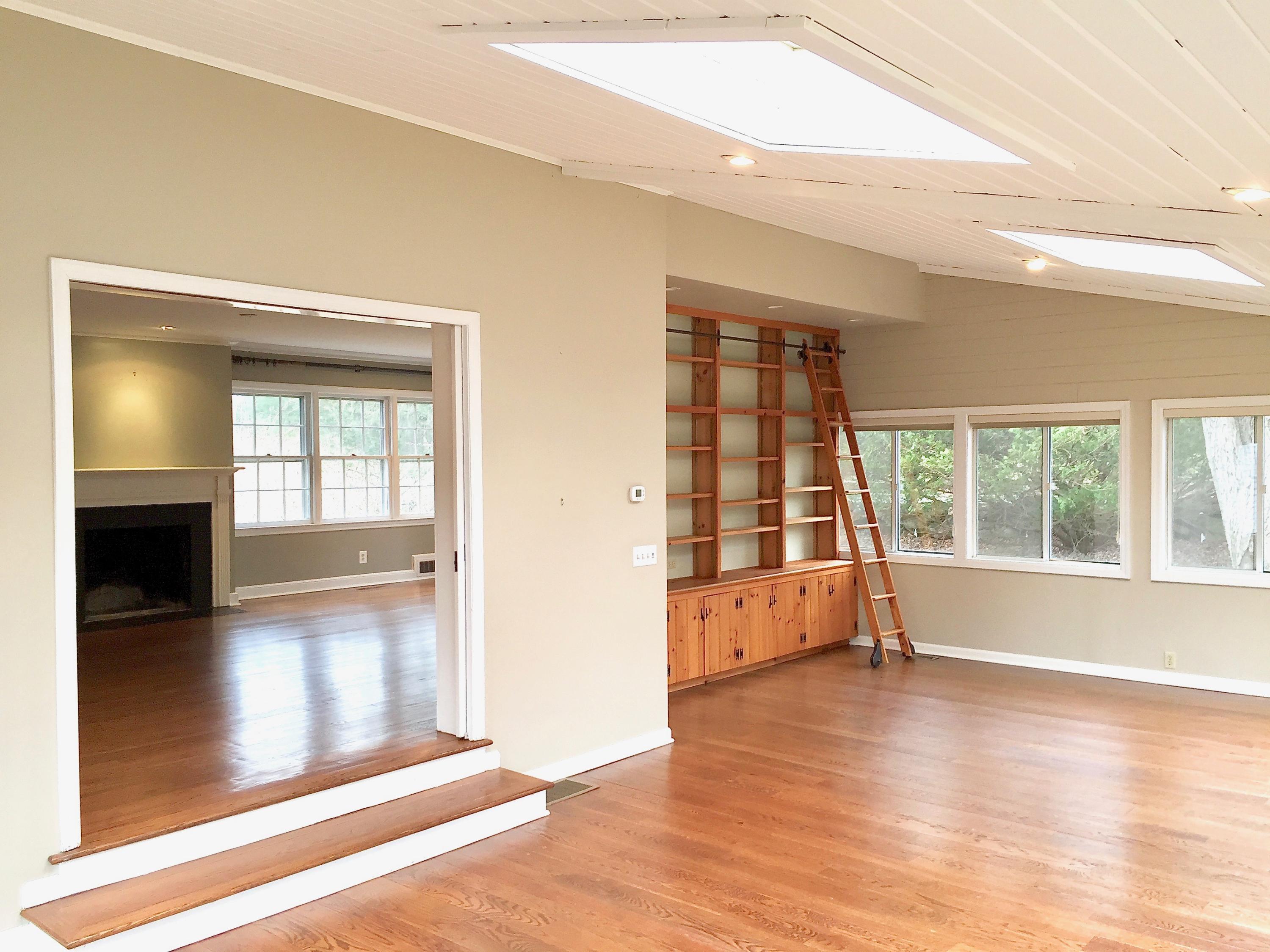 181 Middlesex Road Darien, CT 06820 - Photo 9 of 38 an empty room with wooden floor and windows