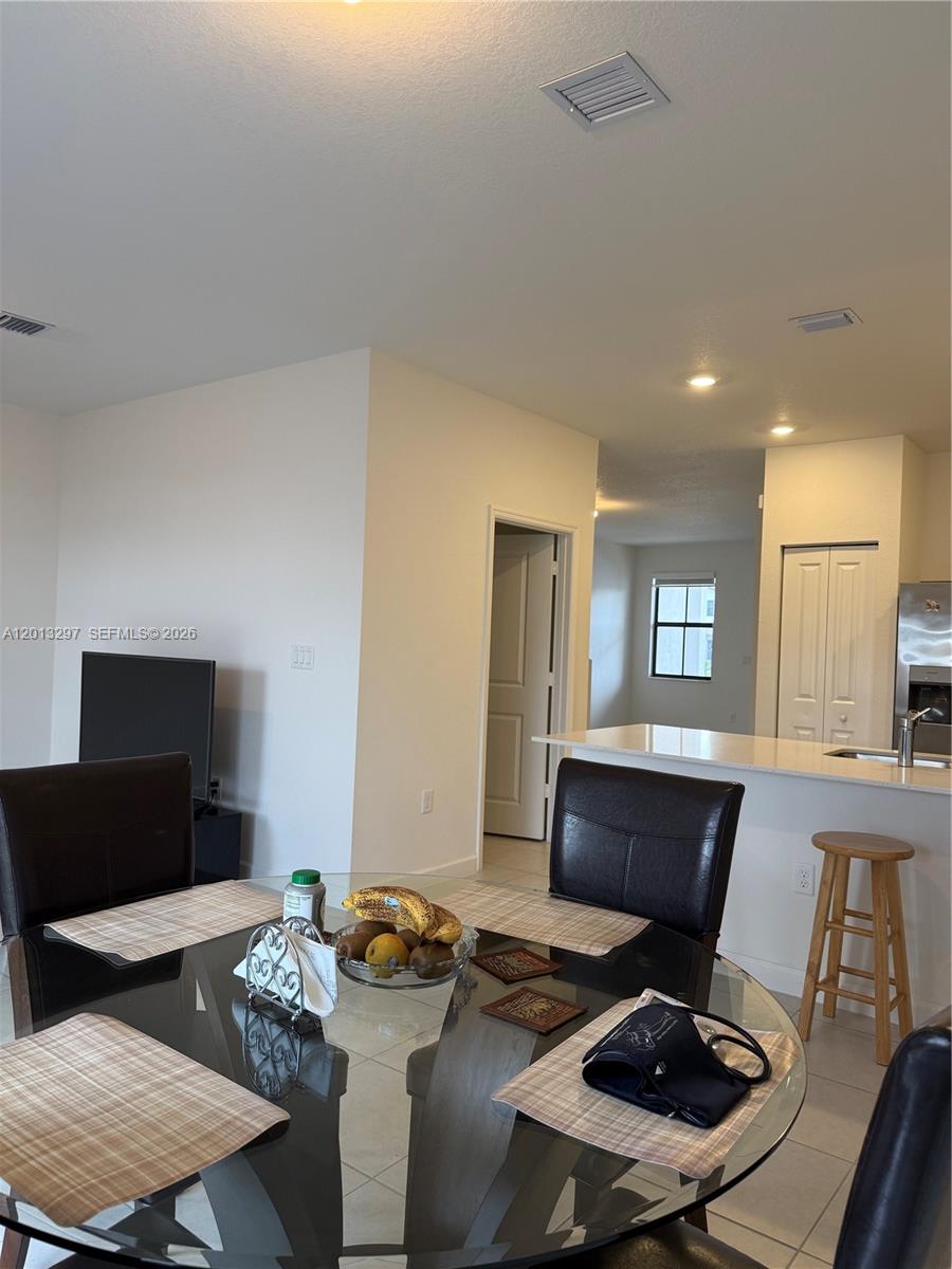 12955 Southwest 231st Terrace, Unit 12955 Miami, FL 33170 - Photo 9 of 26 a living room with furniture and a table