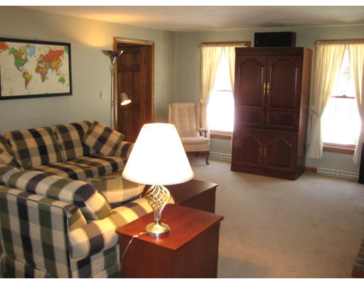 4 Wadsworth Road Ashland, MA 01721 - Photo 12 of 30 a living room with a couch and a window