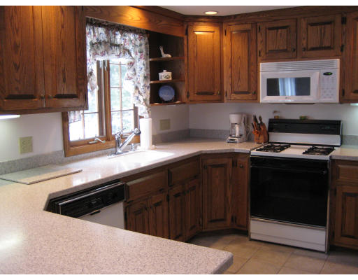 4 Wadsworth Road Ashland, MA 01721 - Photo 8 of 30 a kitchen with stainless steel appliances a stove a sink and a microwave