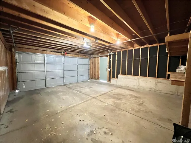 a view of an empty room with a garage