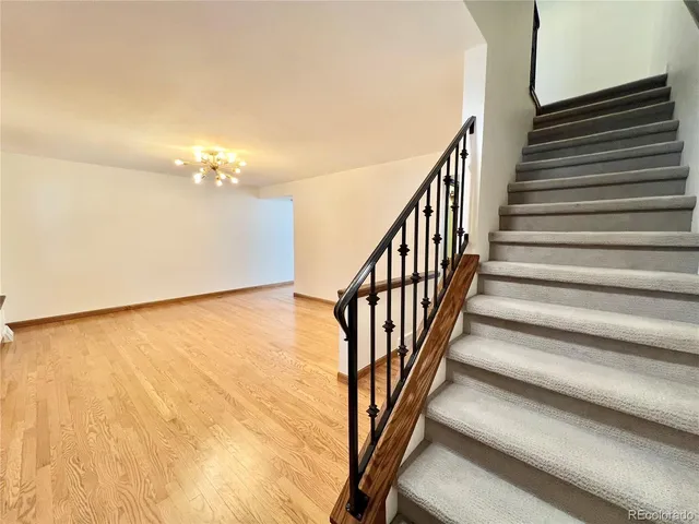 a view of an empty room with stairs