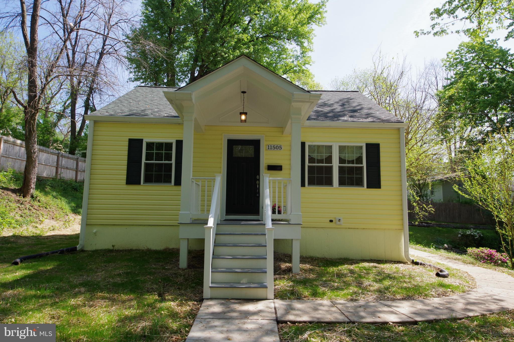 11505 Dewey Road Silver Spring, MD 20906 - Photo 1 of 29 a front view of a house with a yard