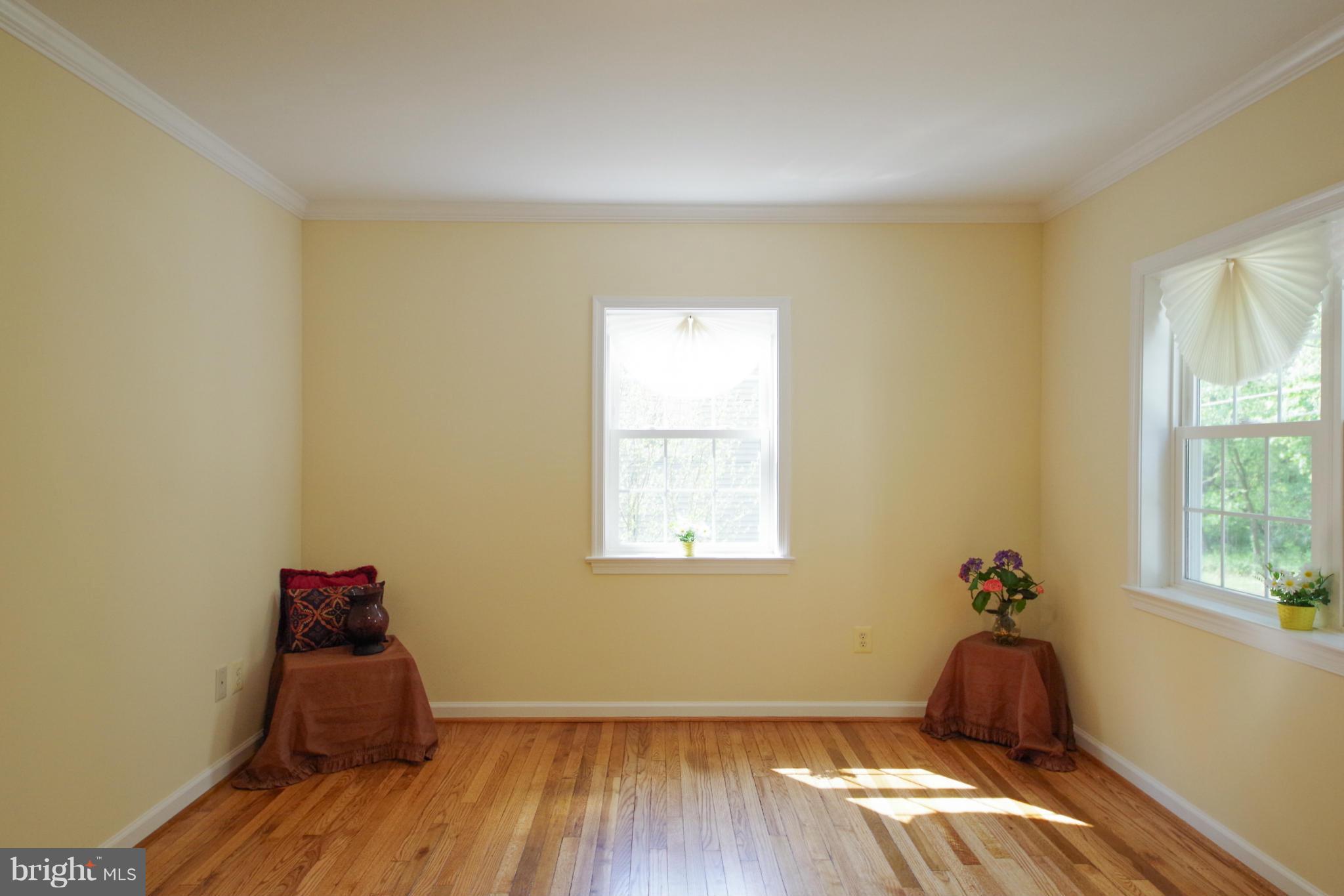 11505 Dewey Road Silver Spring, MD 20906 - Photo 7 of 29 a room with a window and wooden floor