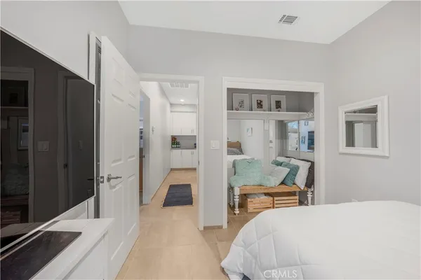 a bedroom with bed and furniture