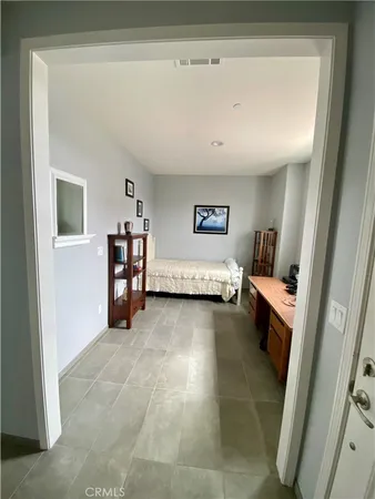a view of livingroom with furniture and workspace