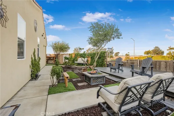 a view of a patio with couches and chairs
