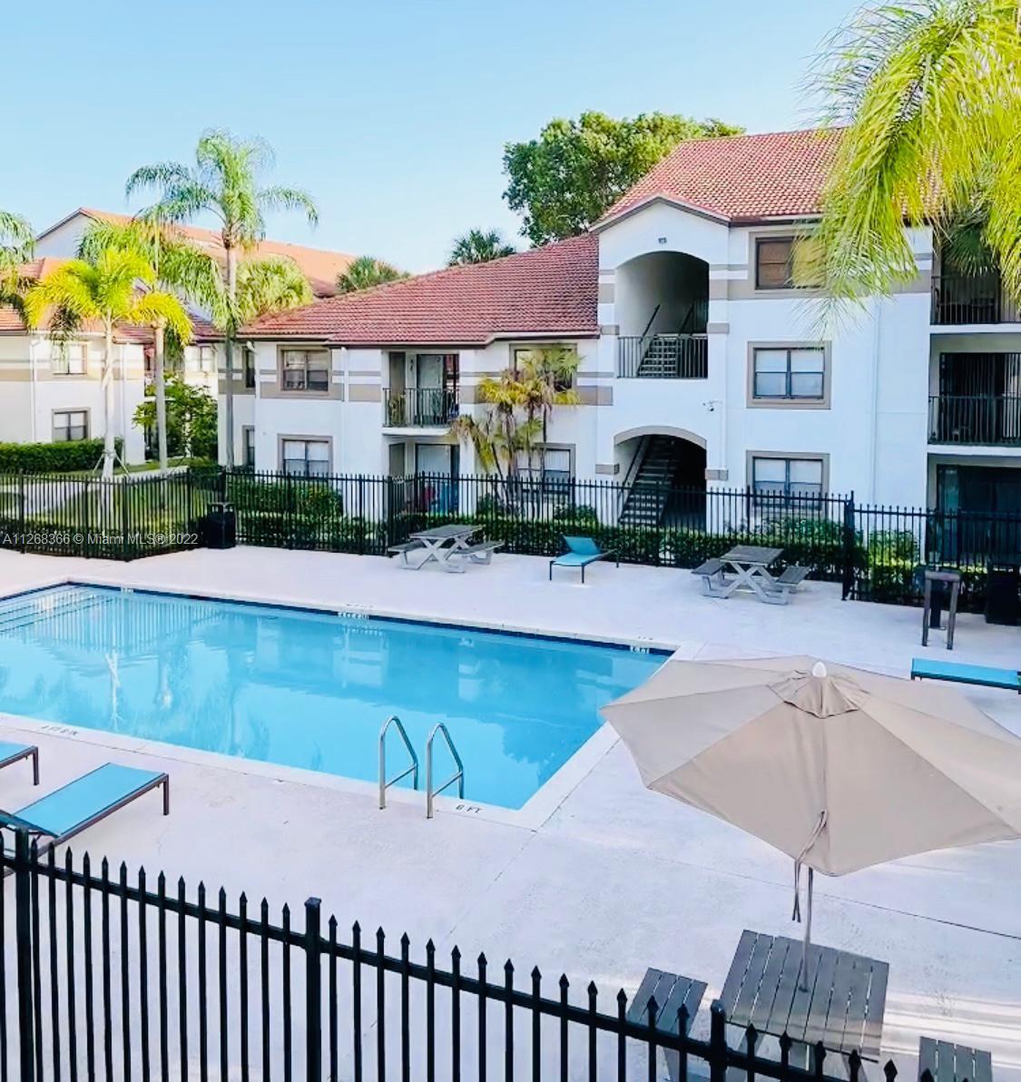 650 South Park Road, Unit 225 Hollywood, FL 33021 - Photo 4 of 26 a view of a house with swimming pool and sitting area