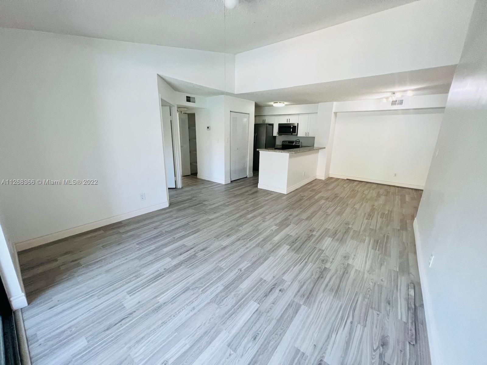 650 South Park Road, Unit 225 Hollywood, FL 33021 - Photo 9 of 26 a view of empty room with wooden floor