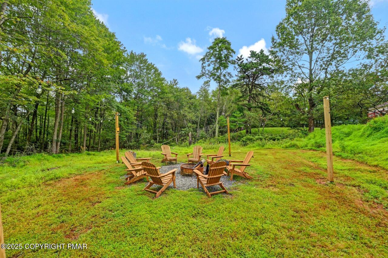 269 Sage Road Long Pond, PA 18334 - Photo 53 of 75 a view of a two chair and table in the garden