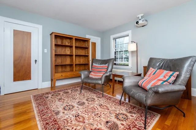 a living room with furniture and a rug