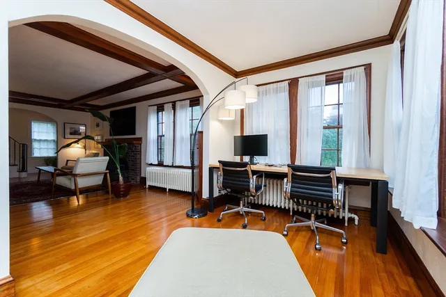 a view of a livingroom with furniture and a flat screen tv