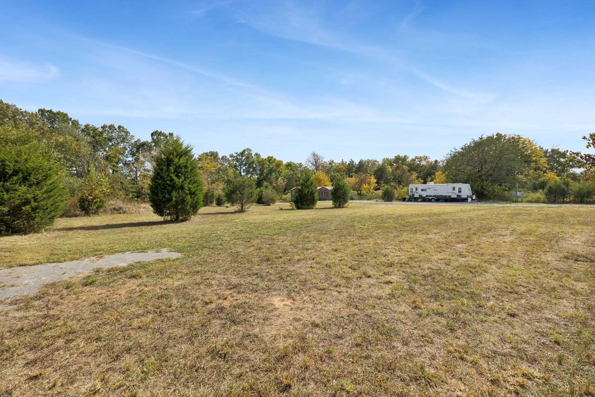 5252 Simmons Bluff Road Lebanon, TN 37090 - Photo 2 of 39 a view of a field with trees in background