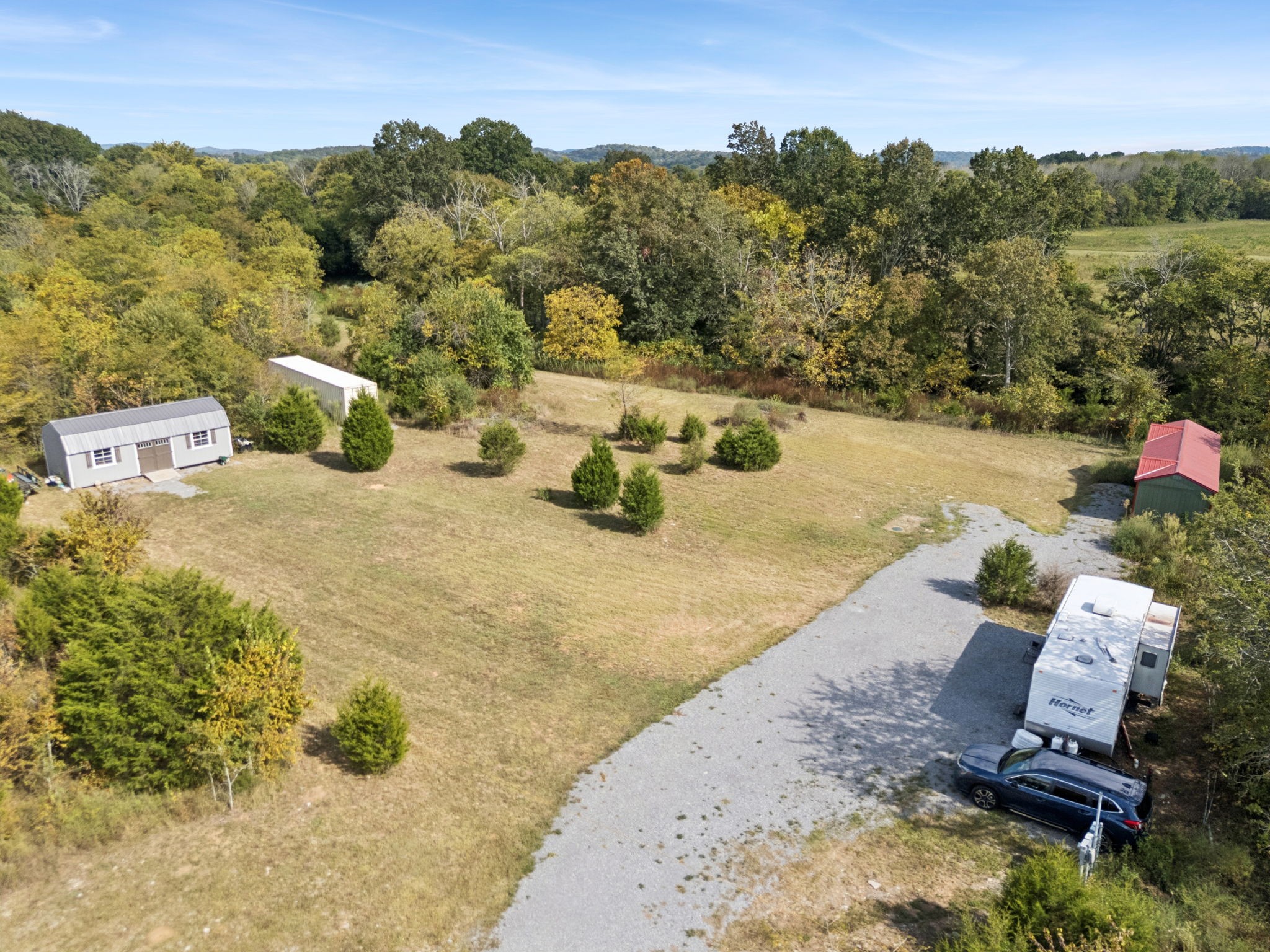 5252 Simmons Bluff Road Lebanon, TN 37090 - Photo 32 of 39 an aerial view of a house with yard swimming pool and mountain view