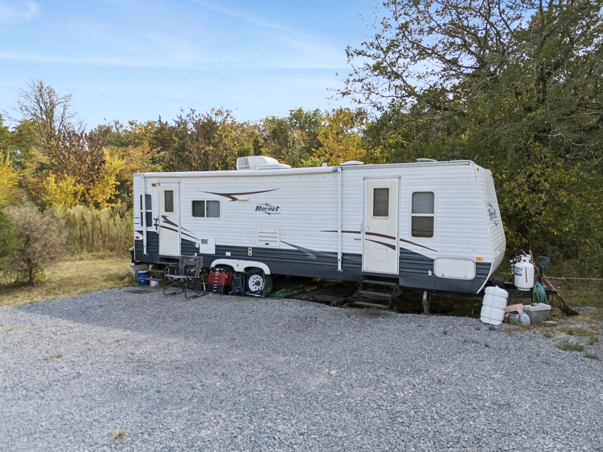5252 Simmons Bluff Road Lebanon, TN 37090 - Photo 34 of 39 a view of a white house with a yard and a large tree