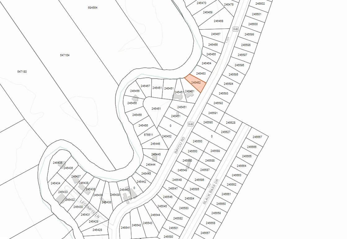 an outdoor space with white wall and a painting on the wall