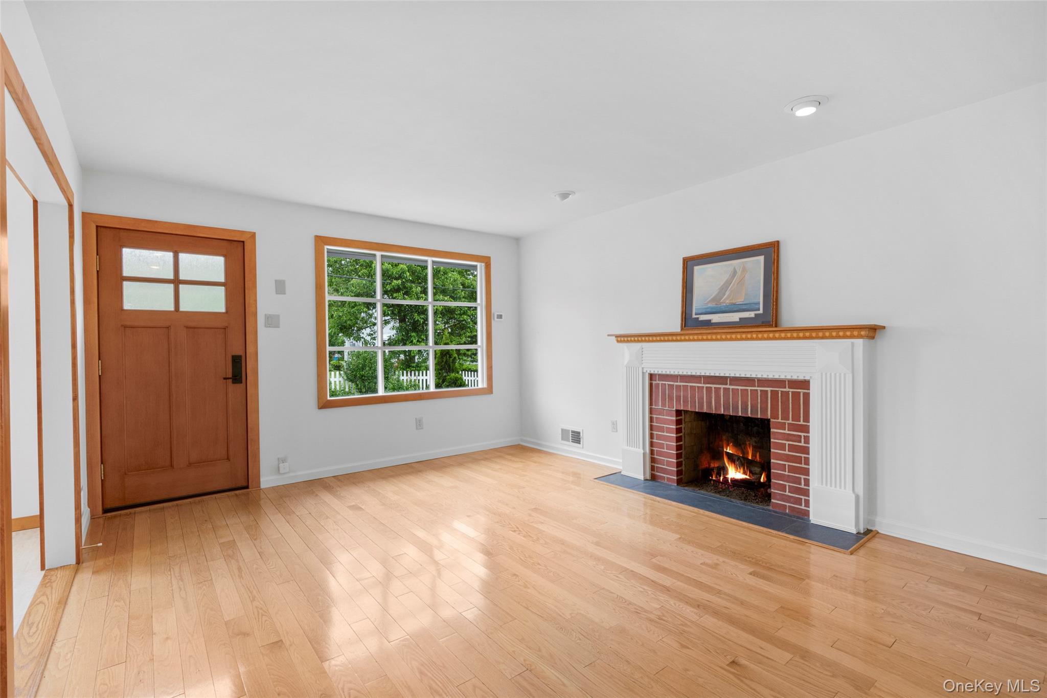 14 Ridgeland Terrace Rye, NY 10580 - Photo 2 of 37 Expansive sun-drenched living room with gas fireplace.