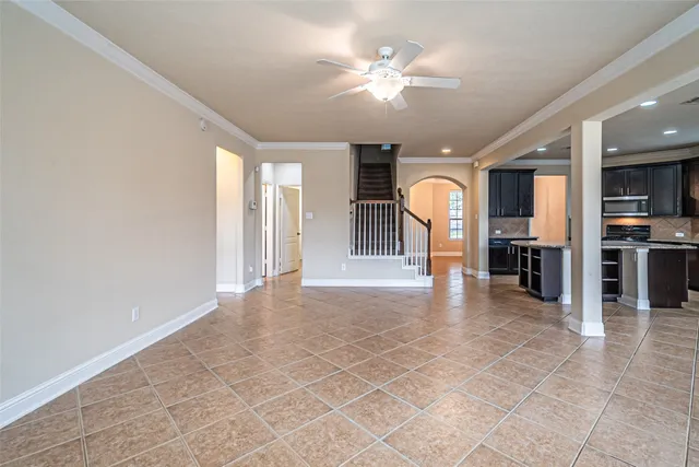 a view of a livingroom with a furniture and chandelier fan