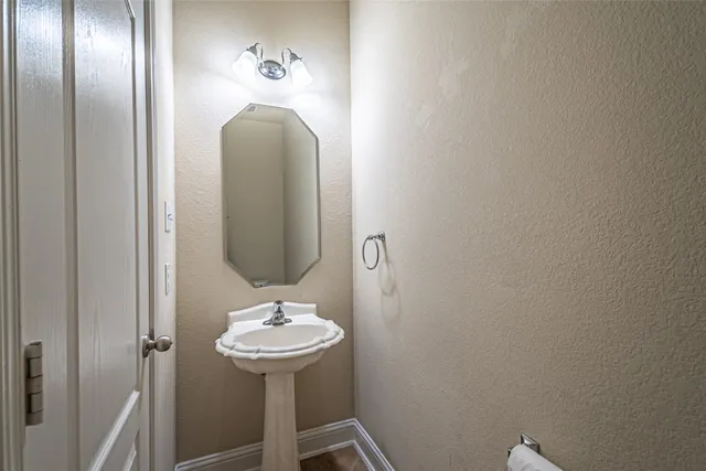 a view of an empty room with a ceiling fan