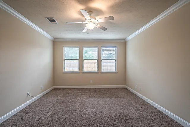 a spacious bathroom with a tub sink and mirror