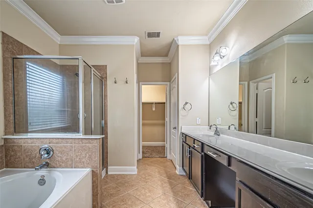 a bathroom with a sink double vanity and a mirror