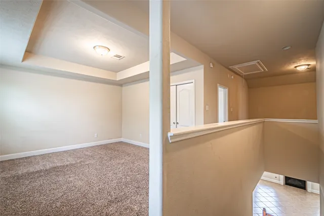 an empty room with a empty space and windows