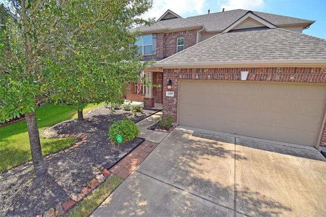 a backyard of a house with yard and outdoor seating