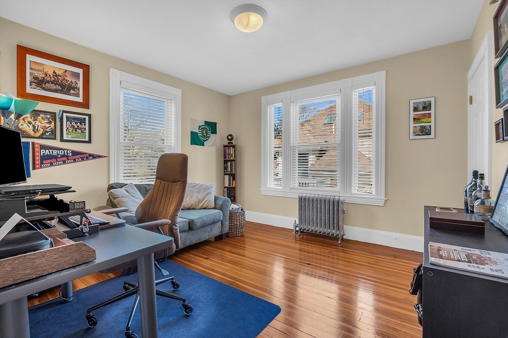73 Orange Street, Unit 2 Waltham, MA 02453 - Photo 15 of 34 a living room with furniture and a window