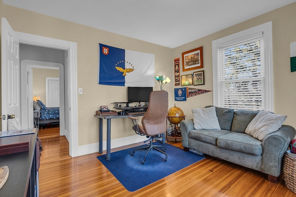 73 Orange Street, Unit 2 Waltham, MA 02453 - Photo 16 of 34 a living room with furniture a rug and a large window