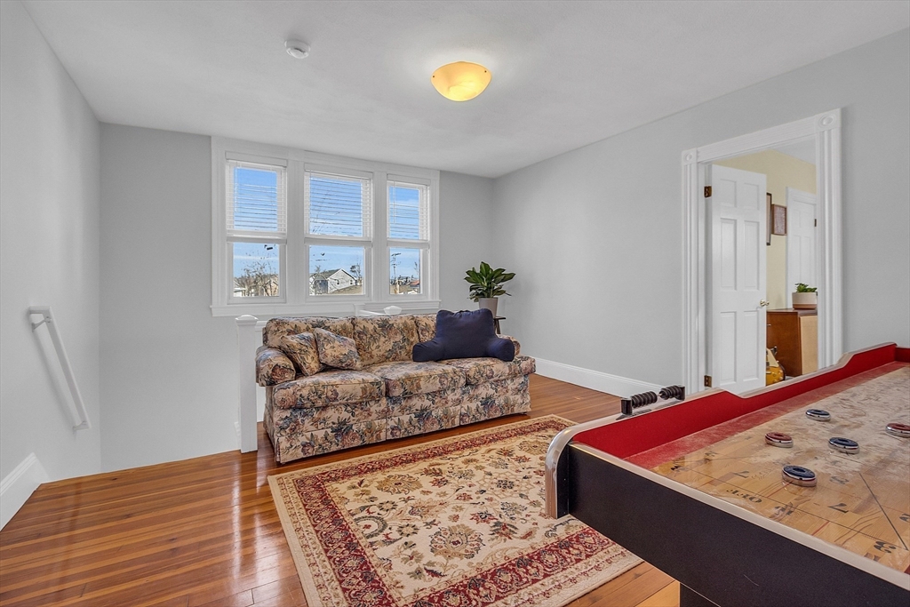 73 Orange Street, Unit 2 Waltham, MA 02453 - Photo 18 of 34 a living room with furniture and a area