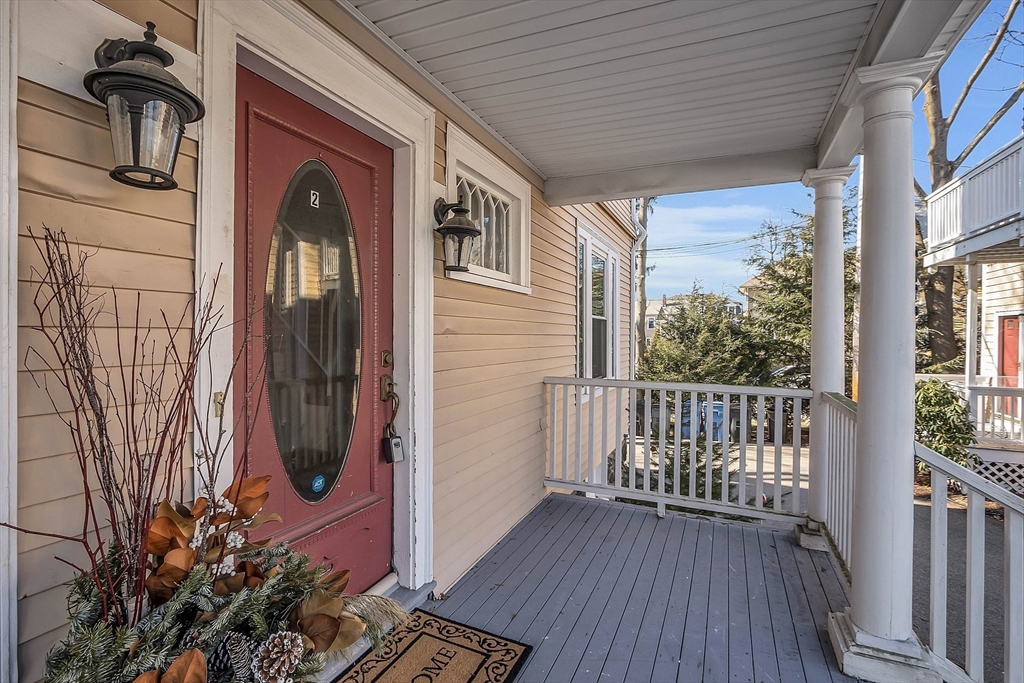 73 Orange Street, Unit 2 Waltham, MA 02453 - Photo 2 of 34 a view of a house with a porch