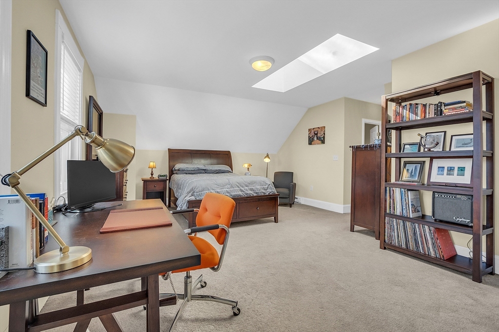 73 Orange Street, Unit 2 Waltham, MA 02453 - Photo 21 of 34 a workspace with furniture and book shelf