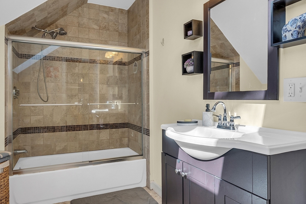 73 Orange Street, Unit 2 Waltham, MA 02453 - Photo 24 of 34 a bathroom with a sink and a mirror