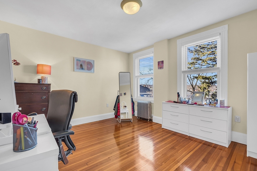 73 Orange Street, Unit 2 Waltham, MA 02453 - Photo 25 of 34 a view of a workspace with furniture and a window