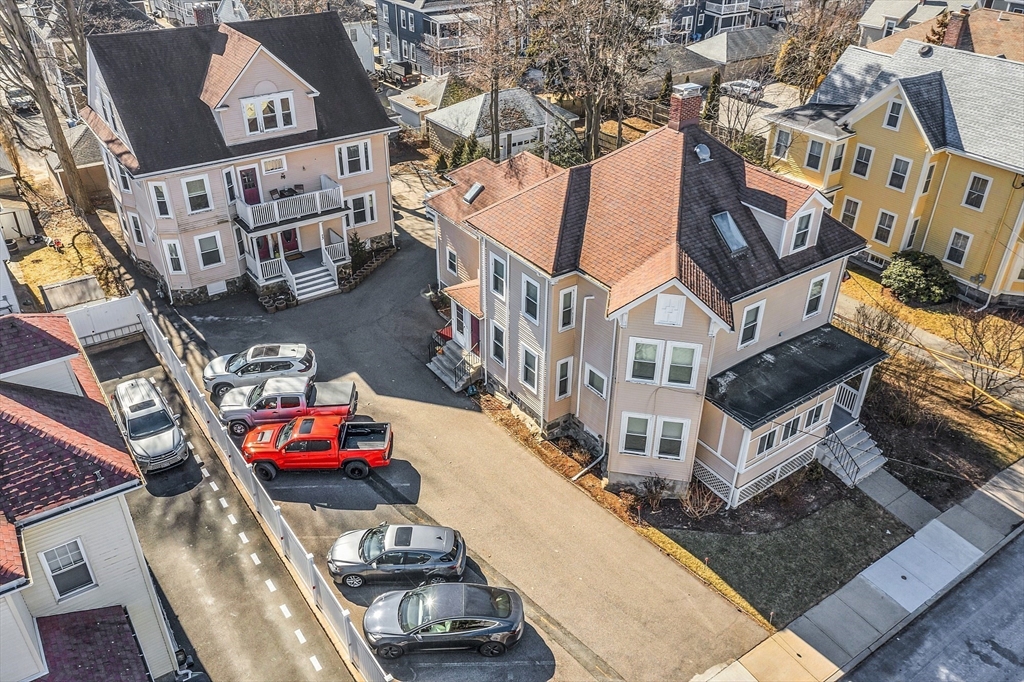 73 Orange Street, Unit 2 Waltham, MA 02453 - Photo 27 of 34 an aerial view of a house with roof deck