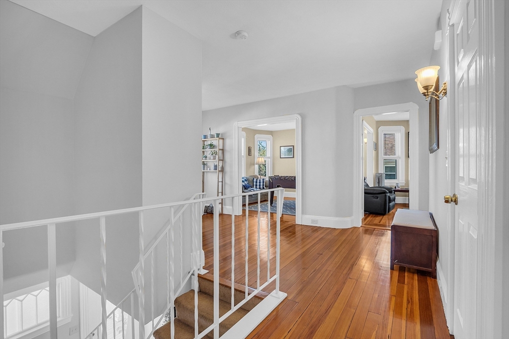 73 Orange Street, Unit 2 Waltham, MA 02453 - Photo 4 of 34 a view of a livingroom with wooden floor and furniture