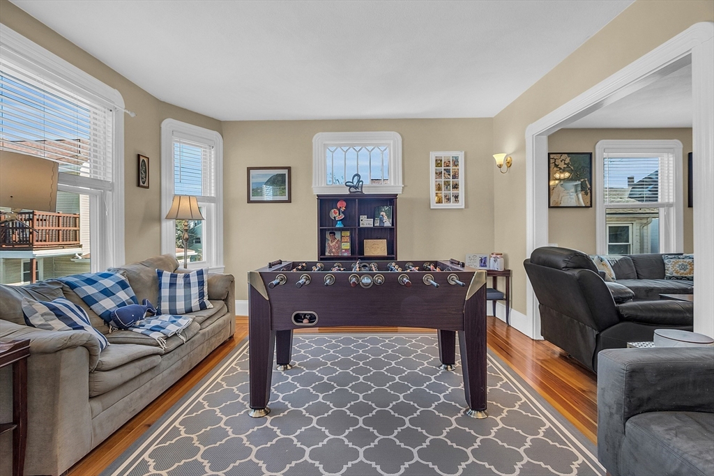 73 Orange Street, Unit 2 Waltham, MA 02453 - Photo 9 of 34 a living room with furniture and a window