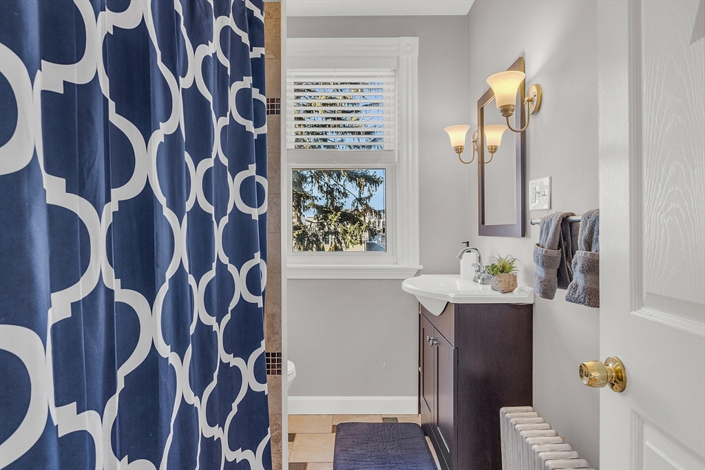 73 Orange Street, Unit 2 Waltham, MA 02453 - Photo 10 of 34 a living room with furniture and a window