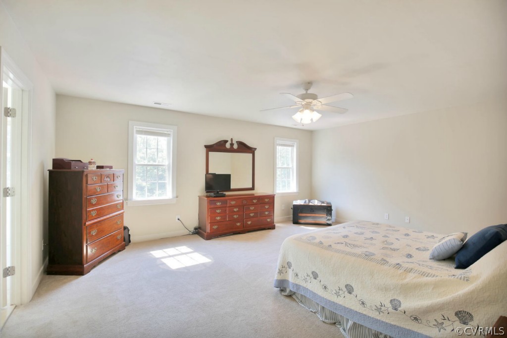 15311 River Road Chesterfield, VA 23838 - Photo 12 of 19 a bedroom with a bed and dresser with mirror