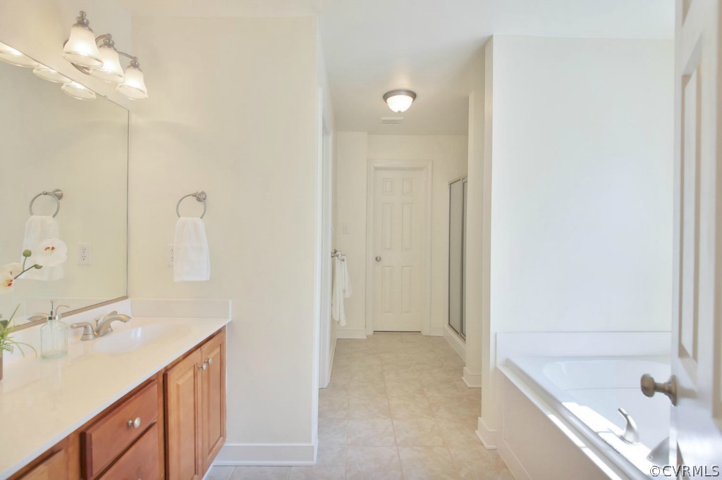 15311 River Road Chesterfield, VA 23838 - Photo 13 of 19 a bathroom with a tub sink and mirror