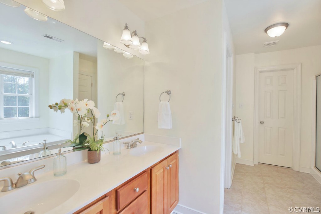 15311 River Road Chesterfield, VA 23838 - Photo 14 of 19 a bathroom with a sink vanity and a mirror