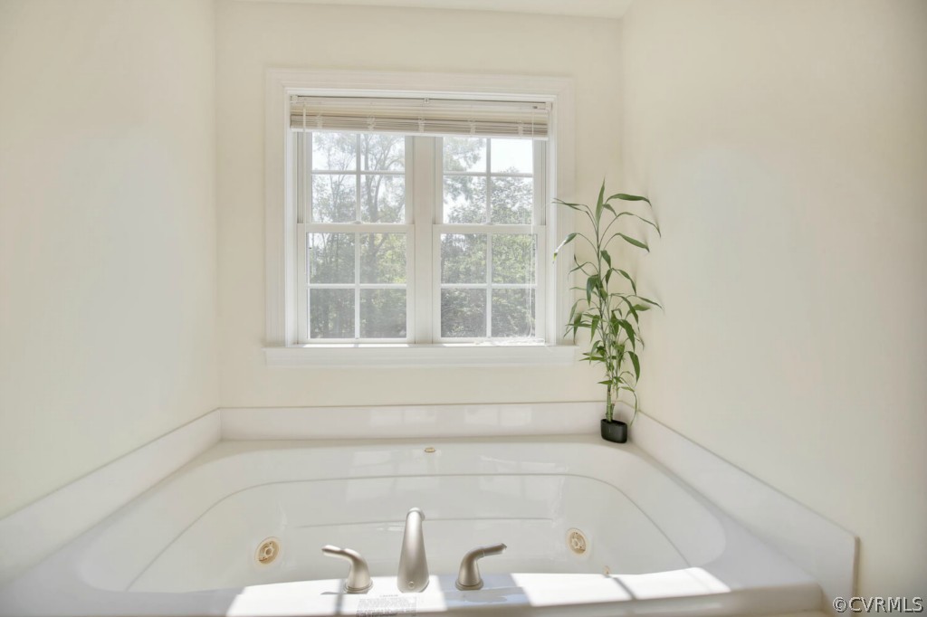 15311 River Road Chesterfield, VA 23838 - Photo 15 of 19 a bathroom with a bathtub and window