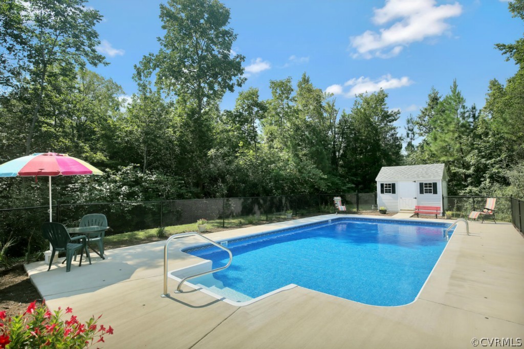 15311 River Road Chesterfield, VA 23838 - Photo 18 of 19 a view of a swimming pool with a patio