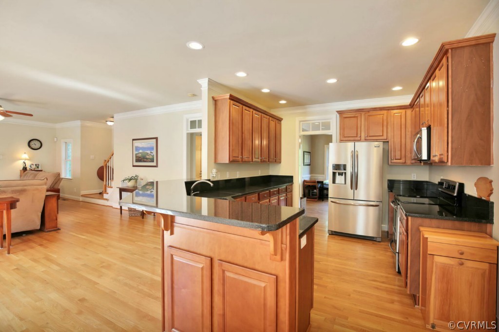 15311 River Road Chesterfield, VA 23838 - Photo 8 of 19 a large kitchen with a large counter top stainless steel appliances and cabinets