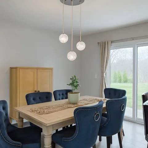 a view of a dining room with furniture and window