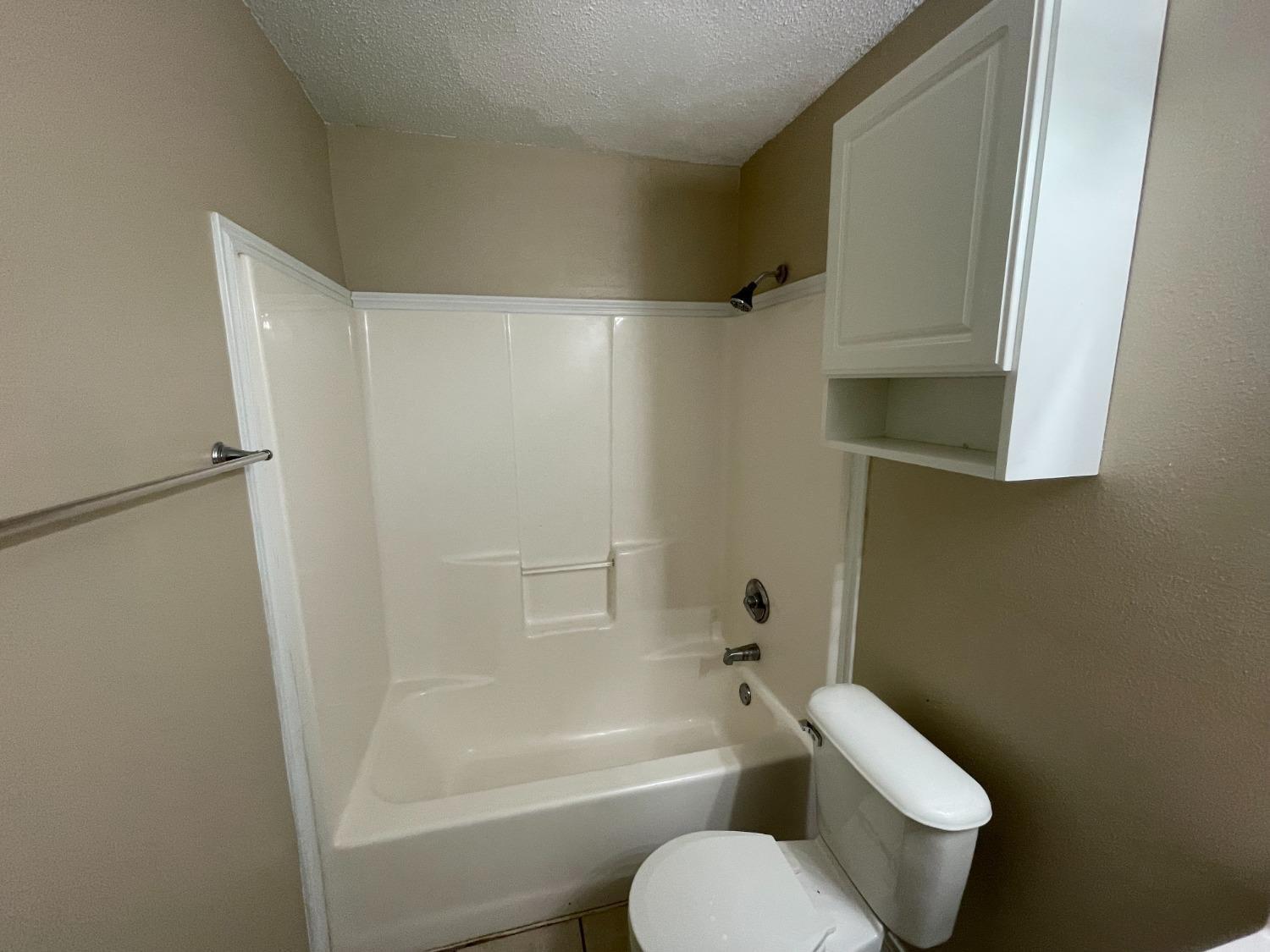 5827 6th Street Lubbock, TX 79416 - Photo 13 of 14 Hall Bathroom