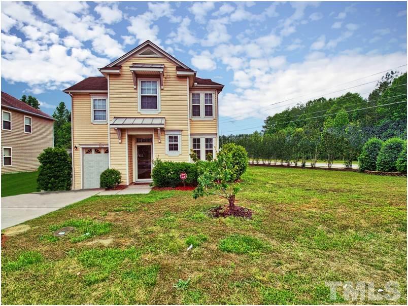 2647 Quarry Ridge Lane Raleigh, NC 27610 - Photo 1 of 18 a front view of a house with a yard and garage